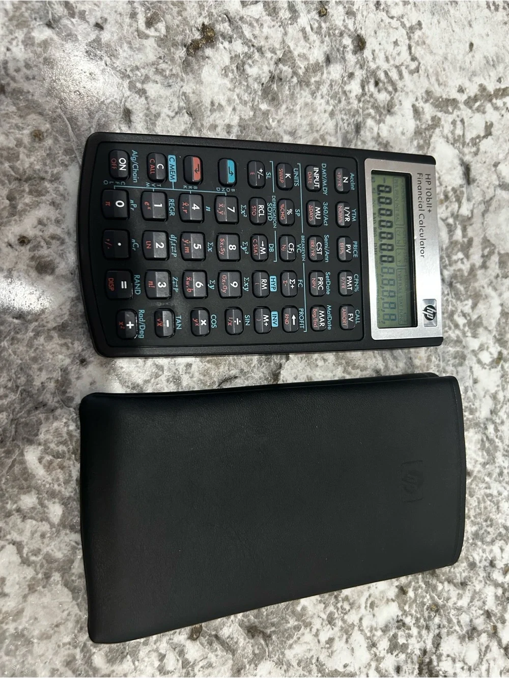 HP Financial Calculator in Black with Teal and Coral Accents